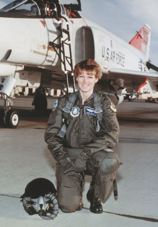 Astronaut Eileen Collins at Test Pilot School, posing in her flight gear